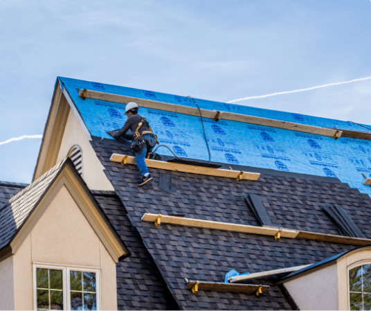 worker on steep roof